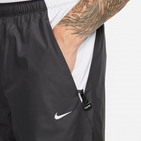 Pantalon survêtement Nike F.C. Woven noir blanc
