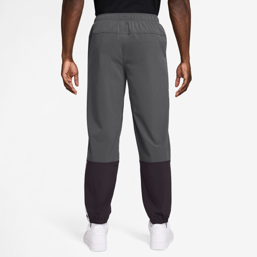 Pantalon survêtement woven Nike gris
