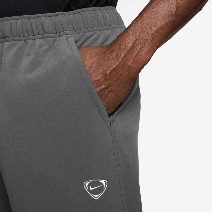 Pantalon survêtement woven Nike gris