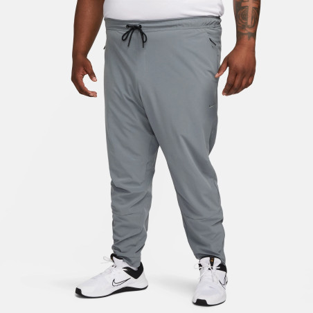 Pantalon survêtement Nike Unlimited gris
