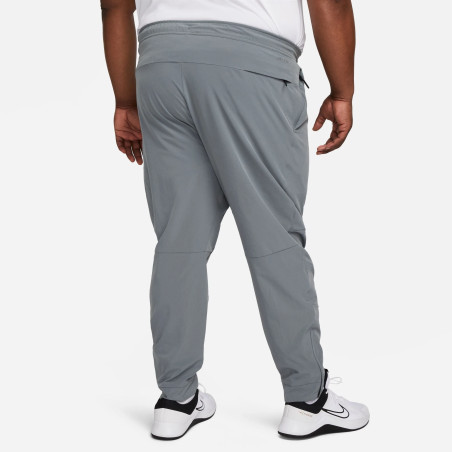 Pantalon survêtement Nike Unlimited gris