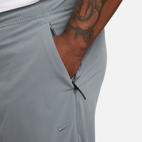 Pantalon survêtement Nike Unlimited gris