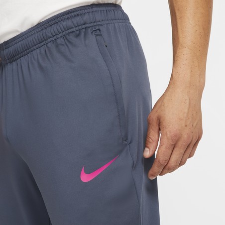 Pantalon survêtement Nike F.C. gris rose