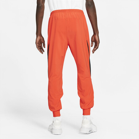 Pantalon survêtement Nike F.C. Joga Bonito orange 2021/22